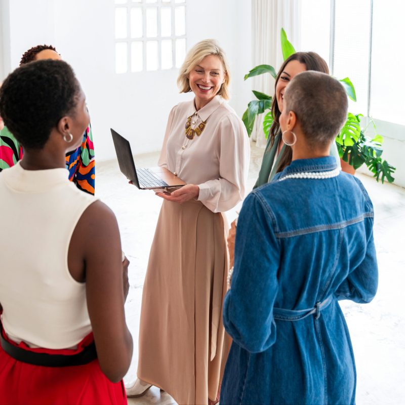 Group of businesswomen meeting in the office Group of beautiful confident businesswomen meeting in the office - Multiethinc female creative team brainstorming at work - Diverse colleagues working together in workshop in a co-working space