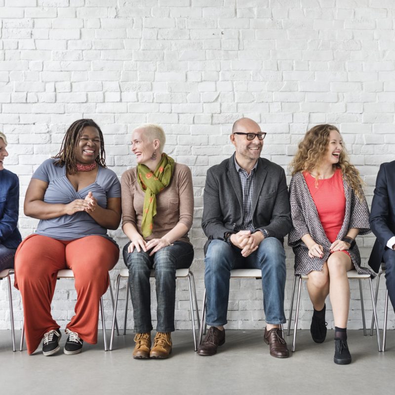 Diverse Group of People Community Togetherness Sitting_APEST Leadership